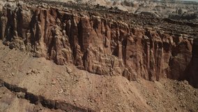 An intimate examination of drone footage of a stone wall formation within Capitol Reef offers a distant glimpse of the horizon.