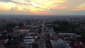 Aerial 4k video of Pekanbaru city during sunset. The capital city of Riau province with many residential buildings.