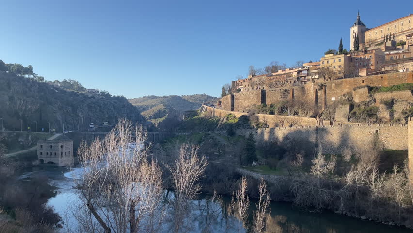 Toledo, Spain - January 21, 2023: The camera panning and showing the Alcazar of Toledo. The medieval building is a major tourist attraction
