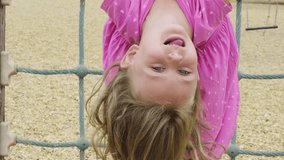 Child playing on outdoor playground. Kids play on school or kindergarten yard. Active kid on monkey bars. Healthy summer activity for children. Little girl climbing - Powered by Shutterstock - Get 15% off with code: PIKWIZARD15