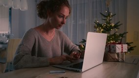 Young caucasian woman doing online shopping using digital laptop