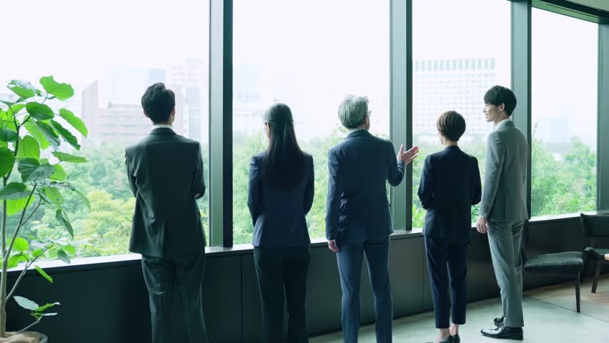 Group of business people standing in office. Management strategy. Slow motion and fast forward. Time remapping. Royalty-Free Stock Footage #1110768367