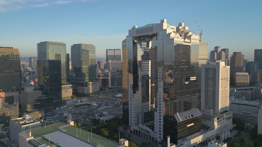 wide flying left view of Umeda Sky Building in Osaka Japan