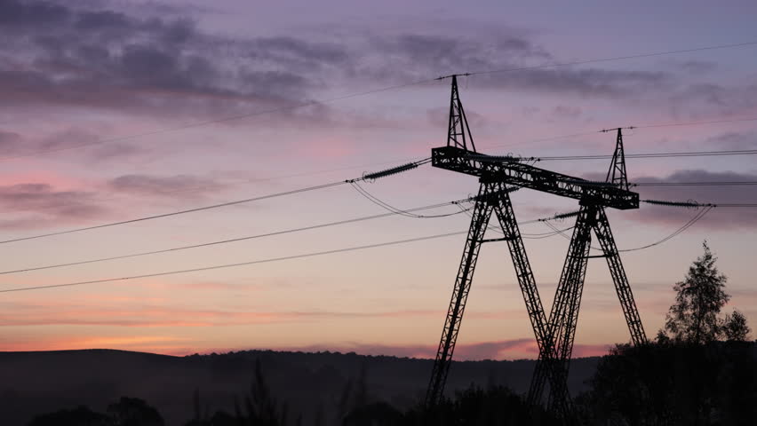 energy stream, Pylon silhouette, Line efficiency. Cables and wires of transmission lines were backlit by glowing sunrise as they connected towers. Royalty-Free Stock Footage #1110774653