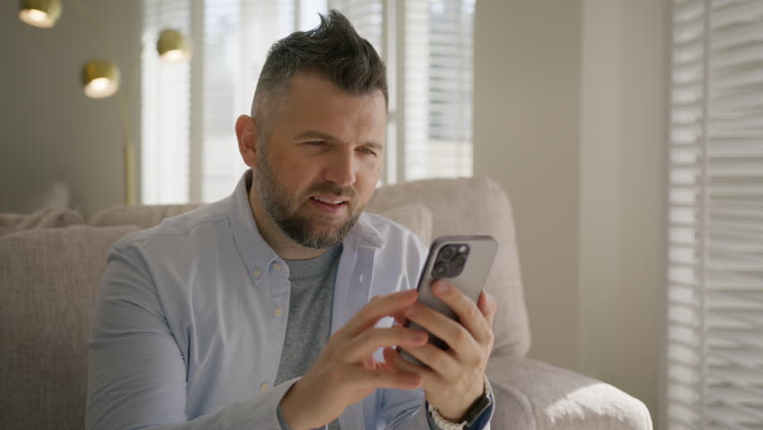 Amazed handsome man receiving sms message offer opportunity. Caucasian happy man reading good news on smartphone. Excited overjoyed stylish male winner celebrating victory success on mobile phone 4K Royalty-Free Stock Footage #1110775359