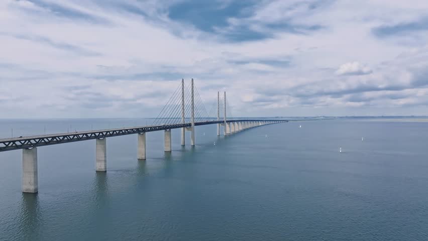 The Oresund bridge between Copenhagen Denmark and Malmo Sweden when sunset in an evening of May Royalty-Free Stock Footage #1110783799