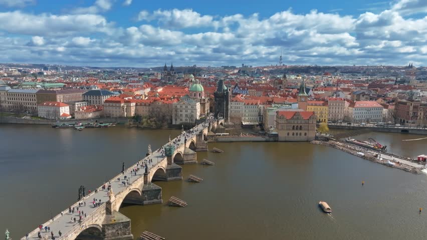 Prague - Charles bridge, Czech Republic. Scenic aerial view on the architecture of the Old Town Pier and Charles Bridge over the Vltava River in Prague, Czech Republic.