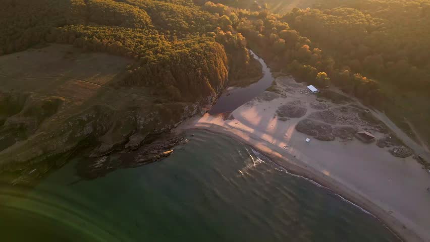 Aerial view of the rocky, wild coast of the Black Sea in Bulgaria, with cliffs, beaches, and green forests Royalty-Free Stock Footage #1110784839