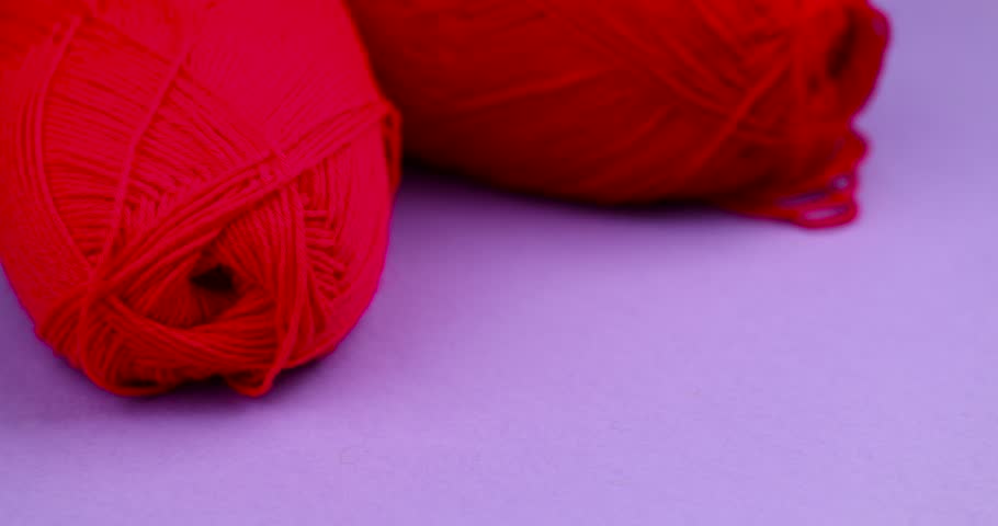 woolen threads of red color for knitting, thin red threads for knitting close-up Royalty-Free Stock Footage #1110785141