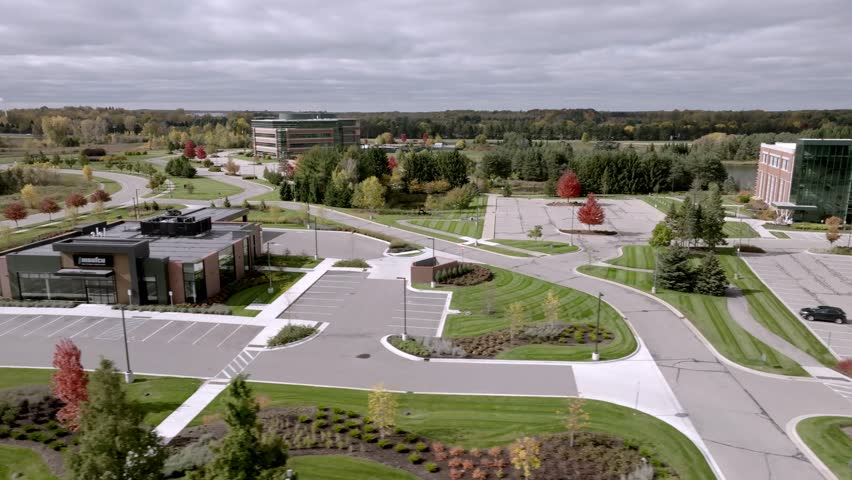 MSUFCU Headquarters building in East Lansing, Michigan with drone video moving left to right.