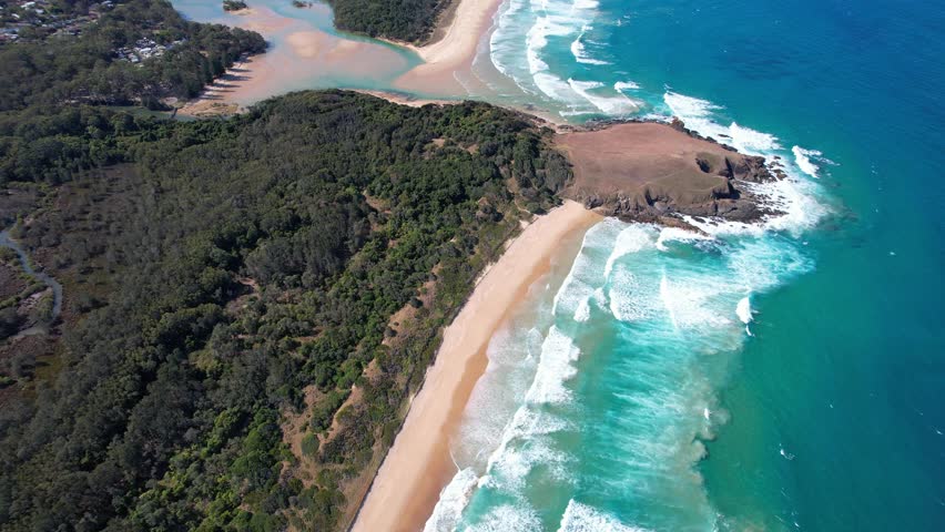 Aerial View Over Scenic Seascape And Green Bluff Headland In New South Wales, Australia - drone shot