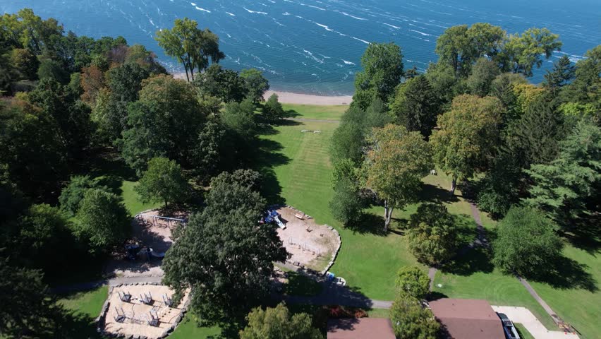Aerial view of ground then water at Keuka Lake Park in the Finger Lakes, NY