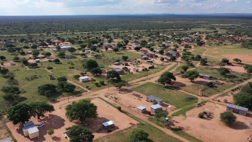 aerial view of an typical african village in southern africa, botswana dry landscape and developments in the rural area Royalty-Free Stock Footage #1110788049