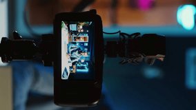 Vertical video Content creator doing technology review of wireless portable speaker for online platforms channel. African american influencer presenting music playing device to his audience - Powered by Shutterstock - Get 15% off with code: PIKWIZARD15