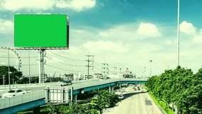 a 4K green screen billboard near the highway road ,high quality
resolution.