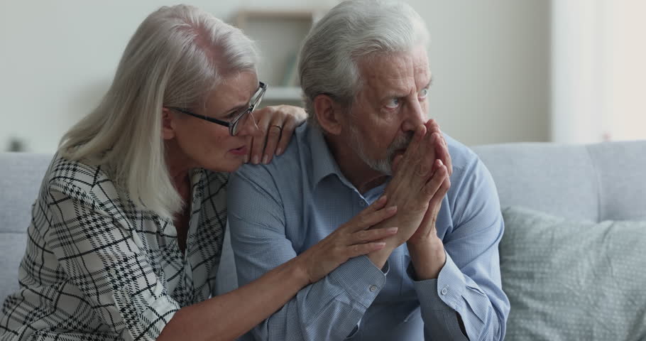 Caring sympathetic senior wife giving comfort, support to stressed frustrated older husband, consoling man, speaking with empathy, patting shoulder, holding hand. Retired couple getting problems Royalty-Free Stock Footage #1110791313