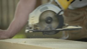 wood processing. close-up of a wooden board. sawing a wooden board. slow motion video. High quality video in FullHD format.