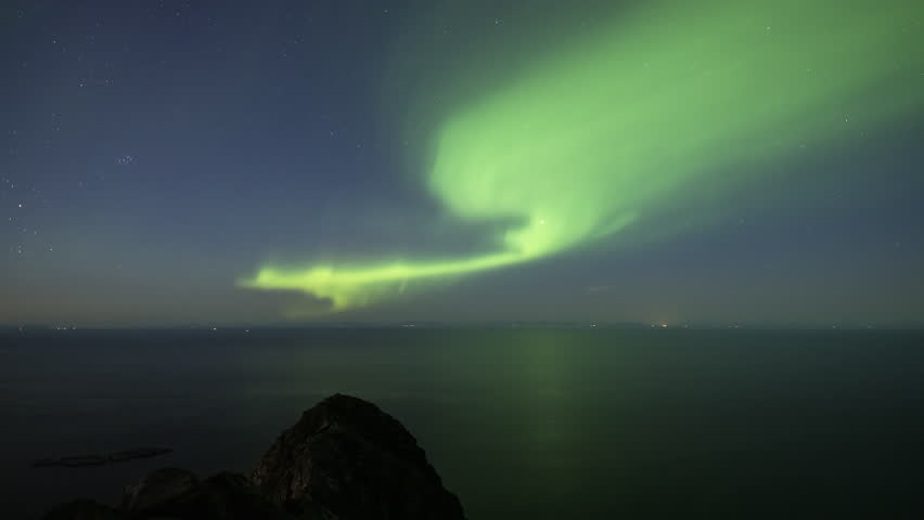 Interesting shape of the Northern Lights over the sea | Shutterstock HD Video #1110807051