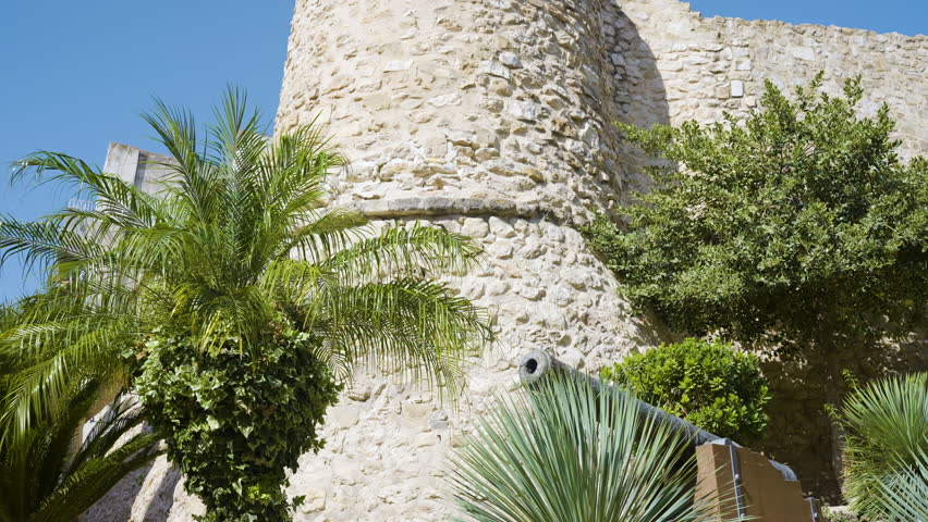 Canons And Castle Walls On Sumer Day In Old Tourist Town.