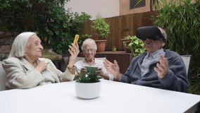 Seniors wearing virtual reality glasses in nursing home