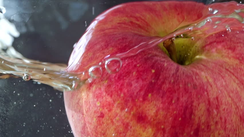 Fresh juicy fruits. Close-up and Slow motion apple falling into water. Water Drops, Splash | Shutterstock HD Video #1110821149