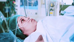 A pregnant woman who gives birth in a hospital is crying. A woman with an IV, experiencing contractions during childbirth. Pregnancy, childbirth. Woman giving birth in maternity hospital - Powered by Shutterstock - Get 15% off with code: PIKWIZARD15