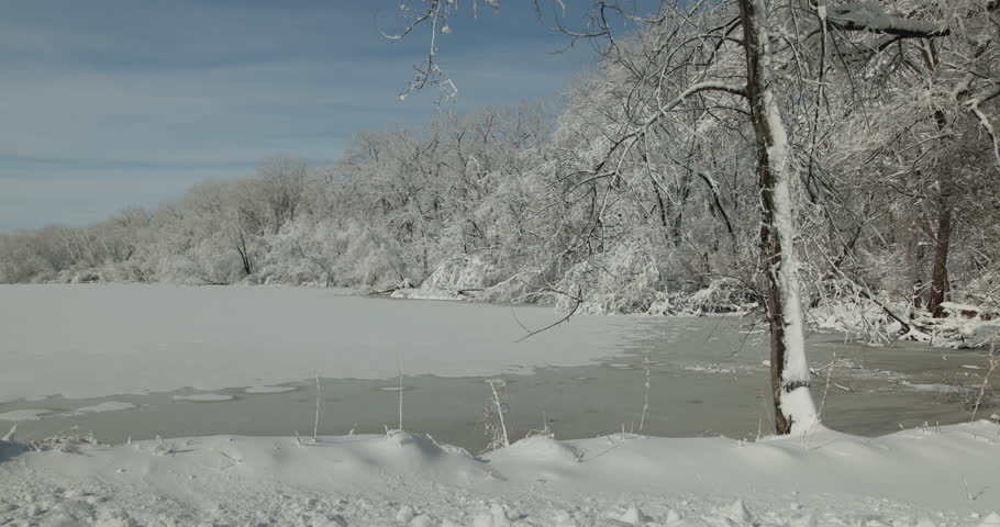 Frozen Lake or Pond in Winter Snow Wintry Peaceful Scenery in Minnesota