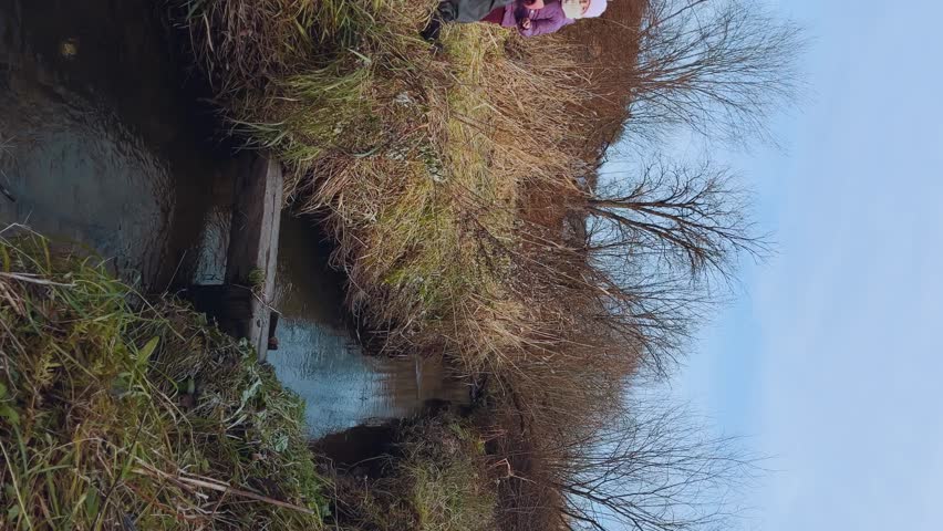 Dad and daughter are traveling, a girl is walking with dad, dad is walking with a child in nature, dad