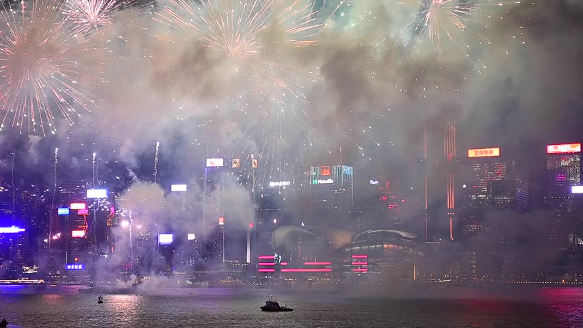 Hong Kong, China - October 1, 2023: The annual Hong Kong National Day Fireworks are huge event with thousands of people lining Victoria Harbour in Tsim Sha Tsui to watch the incredible spectacle. Royalty-Free Stock Footage #1110856243