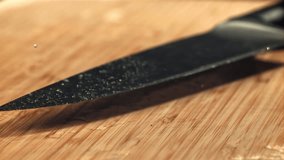 The knife falls on the cutting board. Filmed on a high-speed camera at 1000 fps. High quality FullHD footage - Powered by Shutterstock - Get 15% off with code: PIKWIZARD15