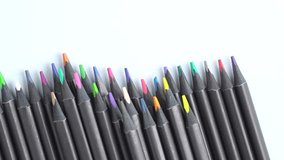 Top view of sharpened multi colored drawing pencils, rotating in a circle. Pile of colored pencils, top view, close-up.  - Powered by Shutterstock - Get 15% off with code: PIKWIZARD15
