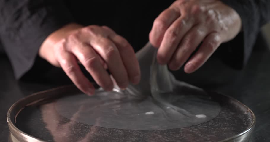 Hands taking soaked rice paper from water bath Royalty-Free Stock Footage #1110864311