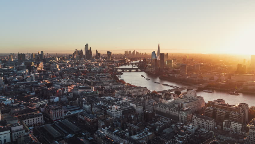 Establishing Aerial View Shot of London UK, United Kingdom, London Skyline, City of London, Shard, Canary Wharf, Heart of the City, enchanted morning light, track in, wow shot Royalty-Free Stock Footage #1110869547