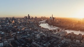 Establishing Aerial View Shot of London UK, United Kingdom, London Skyline, City of London, Shard, Canary Wharf, Heart of the City, enchanted morning light, track in, wow shot