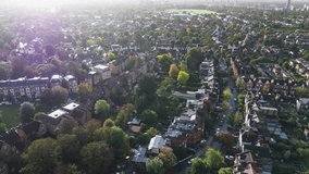 Aerial View Shot of London Suburbs, UK, United Kingdom, Ealing Common, suburbs, neighbourhood, victorian homes, typical houses, English homes victorian, residential area real estate, sun is shining
