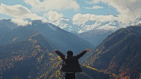 Happy tourist woman open arms into air and enjoying life and freedom on top of mountain in spring or autumn, Happy and drunk on life. - Powered by Shutterstock - Get 15% off with code: PIKWIZARD15