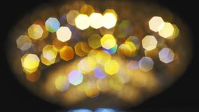 Video clip of blurred sparkling lights, blurred sparkling lights. The slow motion of the twinkling lights spins beautifully.