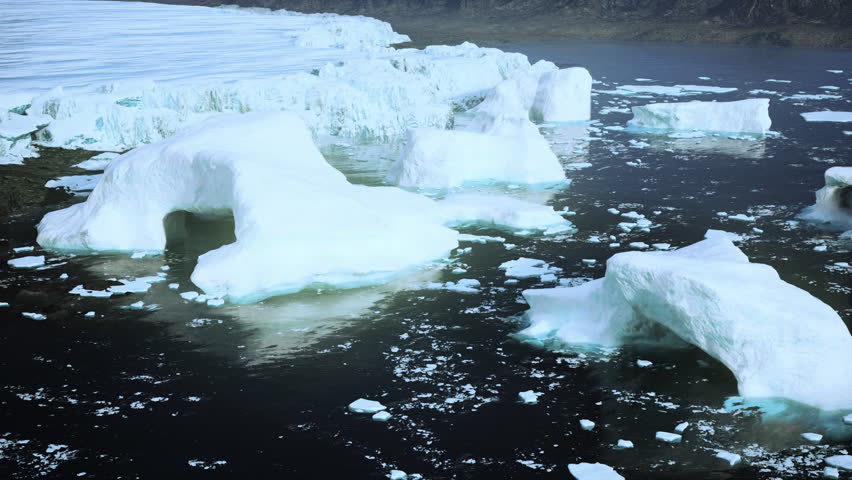 A group of icebergs floating on top of a body of water Royalty-Free Stock Footage #1110878787