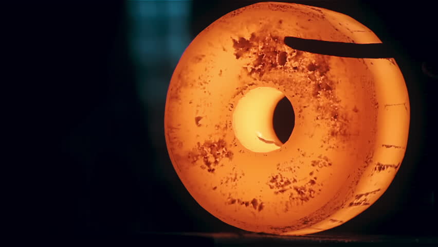 Stamping, Forming. A blacksmith works with molten bright orange metal wheel steel using mechanical shears. Forging. Industrial line. Heavy machinery. Ferrous metallurgy. Close-up. Slow motion | Shutterstock HD Video #1110882093