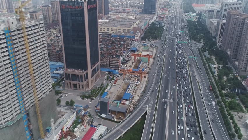 Zhongzhou Avenue and Bohai Expressway, China. Zhongzhou North Road is a road lying on the central axis of Beijing. (aerial photography) Royalty-Free Stock Footage #1110883997