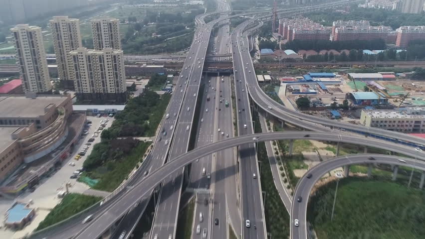 Zhongzhou Avenue and Bohai Expressway, China. Zhongzhou North Road is a road lying on the central axis of Beijing. (aerial photography) Royalty-Free Stock Footage #1110884003