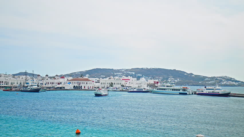 View of Mykonos SeaBus: Bus and Taxi Stations on the Greek Islands. Ships and boats transporting passages in Mykonos, Cyclades islands.