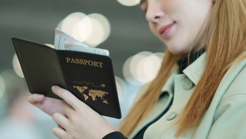 Asian businesswoman looking flight schedule on timetable and go to check-in and boarding gate in airport terminal. Business people working with travel by airplane transportation on holiday vacation. | Shutterstock HD Video #1110901855