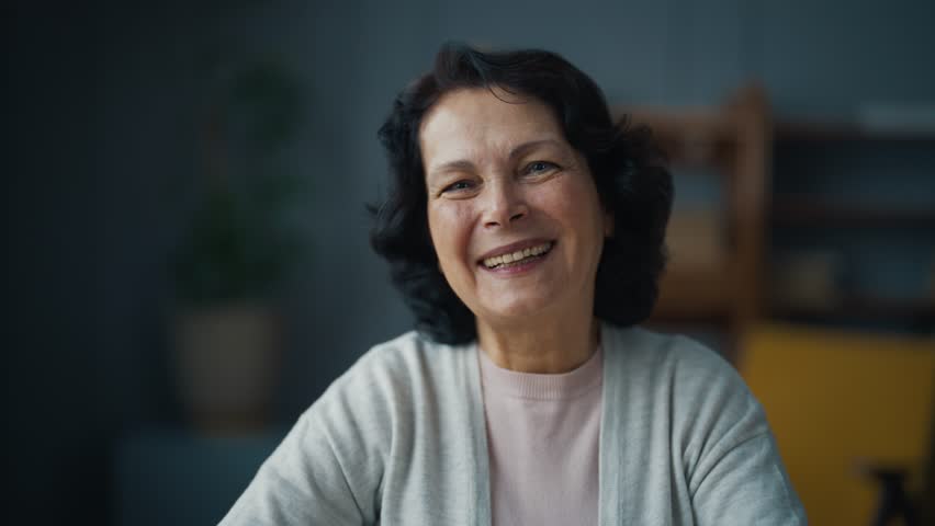 Portrait happy smiling laughing senior brunette woman looking at camera. Friendly old lady, mature positive female sitting enjoying life. Pensioner retiree lifestyle, sincere human emotions concept.