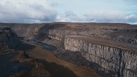 Jökulsárgljúfur National Park. Chaotic canyon and volcanic mountains. Basalt columns, waterfalls, caves, traces of ancient craters. Breathtaking landscapes, cinematic clip.