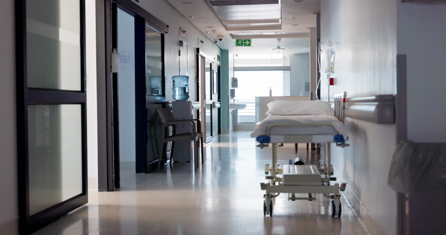 Hospital, empty hallway and healthcare or medicare at clinic, medical and care in corridor. Medicine, wellness and treatment for illness, support and trust in emergency, lobby and service for injury Royalty-Free Stock Footage #1110911933