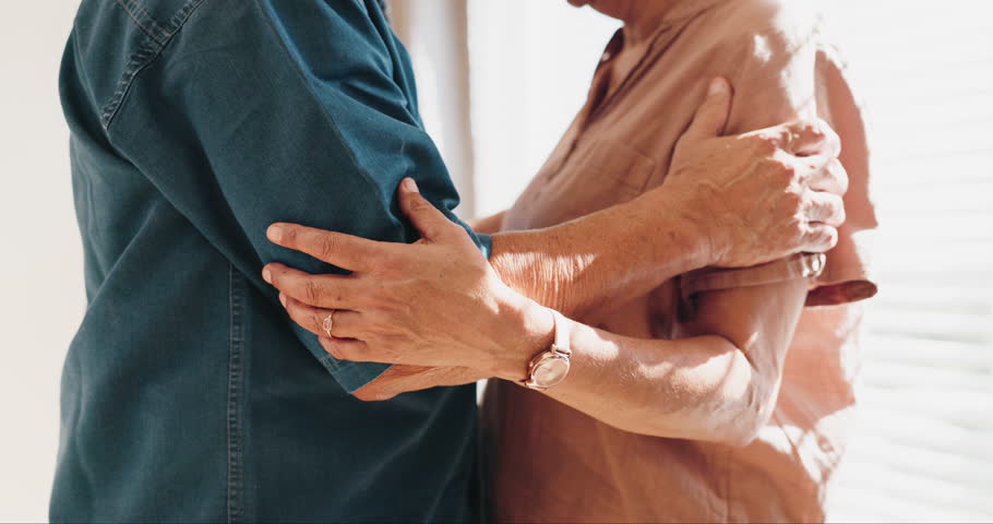 Hands, home or elderly couple slow dancing, wellness or enjoy retirement, quality time or connect in apartment. Lounge music, romantic bond or body of senior partner, old man or people with love song