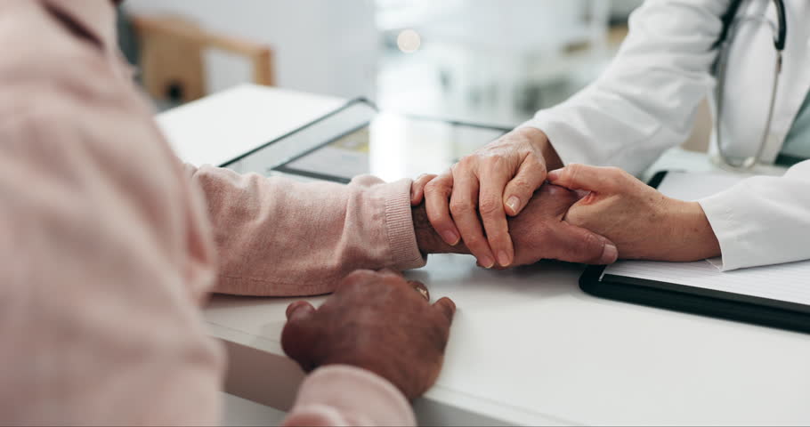 Holding hands, doctor and comfort patient with cancer, sick or disease in hospital. Medical professional, support and person with empathy, kindness or sorry, consulting and courage for hope in clinic Royalty-Free Stock Footage #1110915389