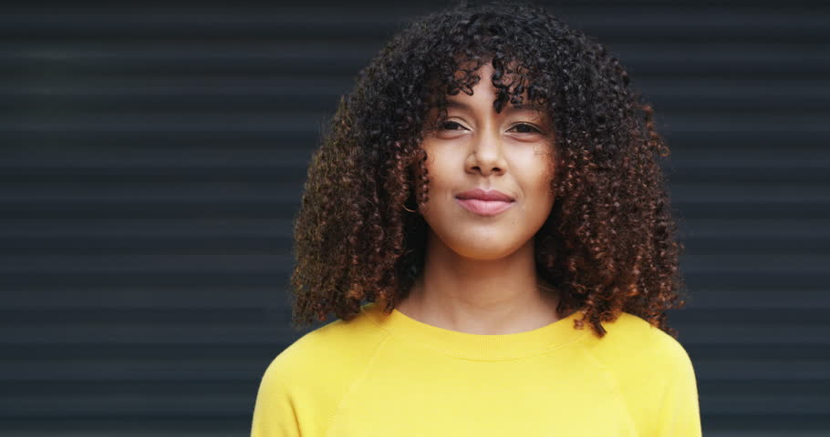 Happy, face and woman with rocker hands, dancing and excited on a dark studio background. Portrait, person and model with freedom, culture and attitude with punk gesture and emoji with head shaking