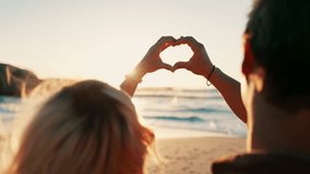 Heart, hands and couple zoom at a beach with love, freedom or solidarity, support or commitment in nature. Summer, romance and closeup of people with emoji frame at sea for travel, adventure or bond - Powered by Shutterstock - Get 15% off with code: PIKWIZARD15